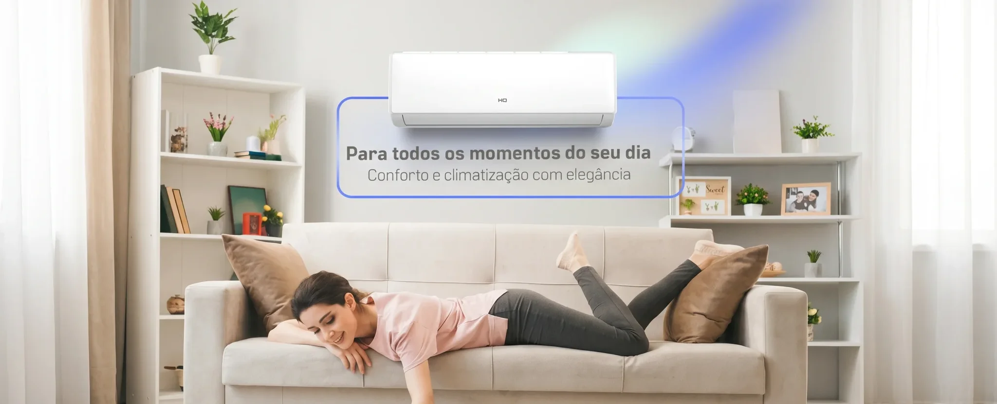 Woman relaxing on a sofa in a living room under a wall-mounted HQ air conditioner unit with a cooling air glow.