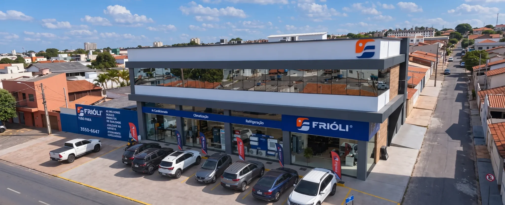 Aerial view of Frioli storefront building specializing in HVAC and refrigeration with cars in the parking lot.